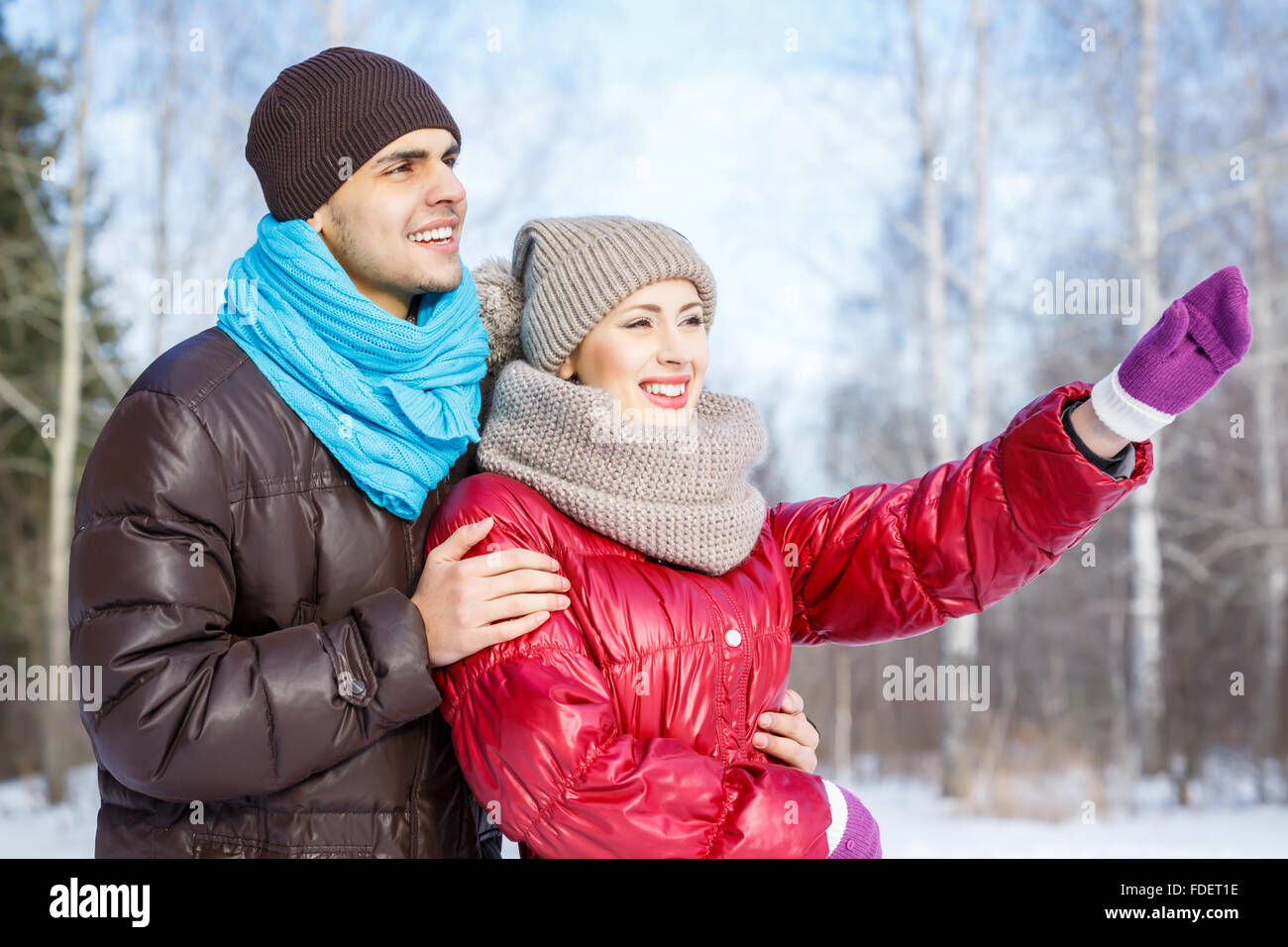 Happy young couple in winter park having fun Stock Photo - Alamy
