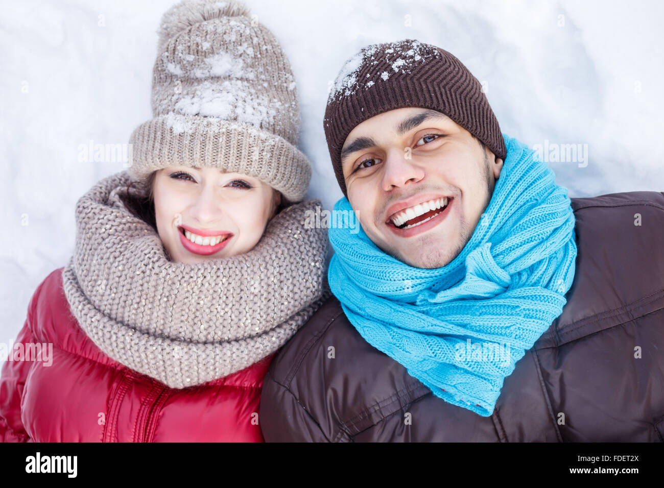 Happy young couple in winter park having fun Stock Photo - Alamy