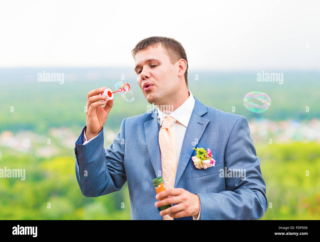 groom blowing bubbles Stock Photo Alamy