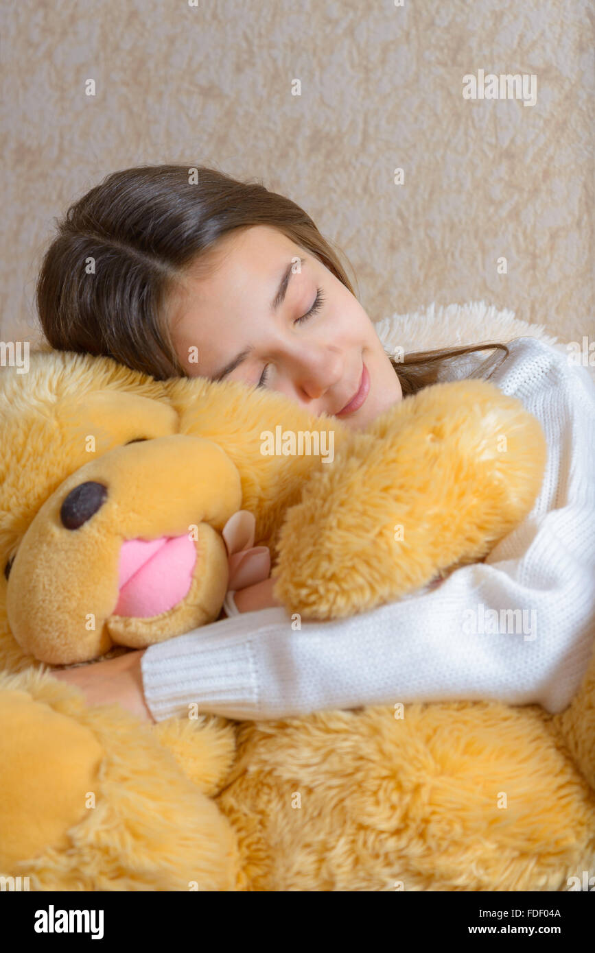 The girl sleeps with a toy Stock Photo