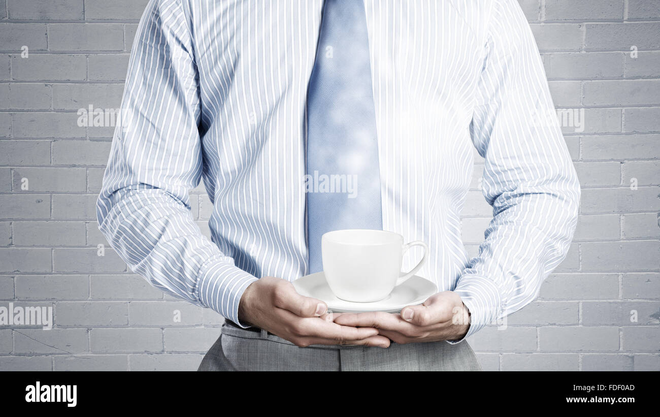 Close up of businessman holding in hands white cup Stock Photo - Alamy