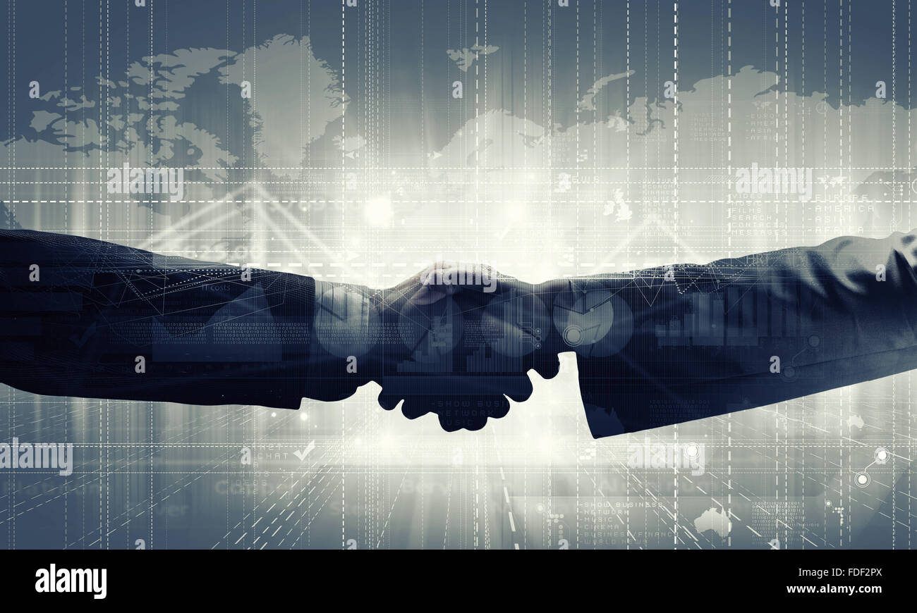 Close up of business handshake on digital background Stock Photo - Alamy