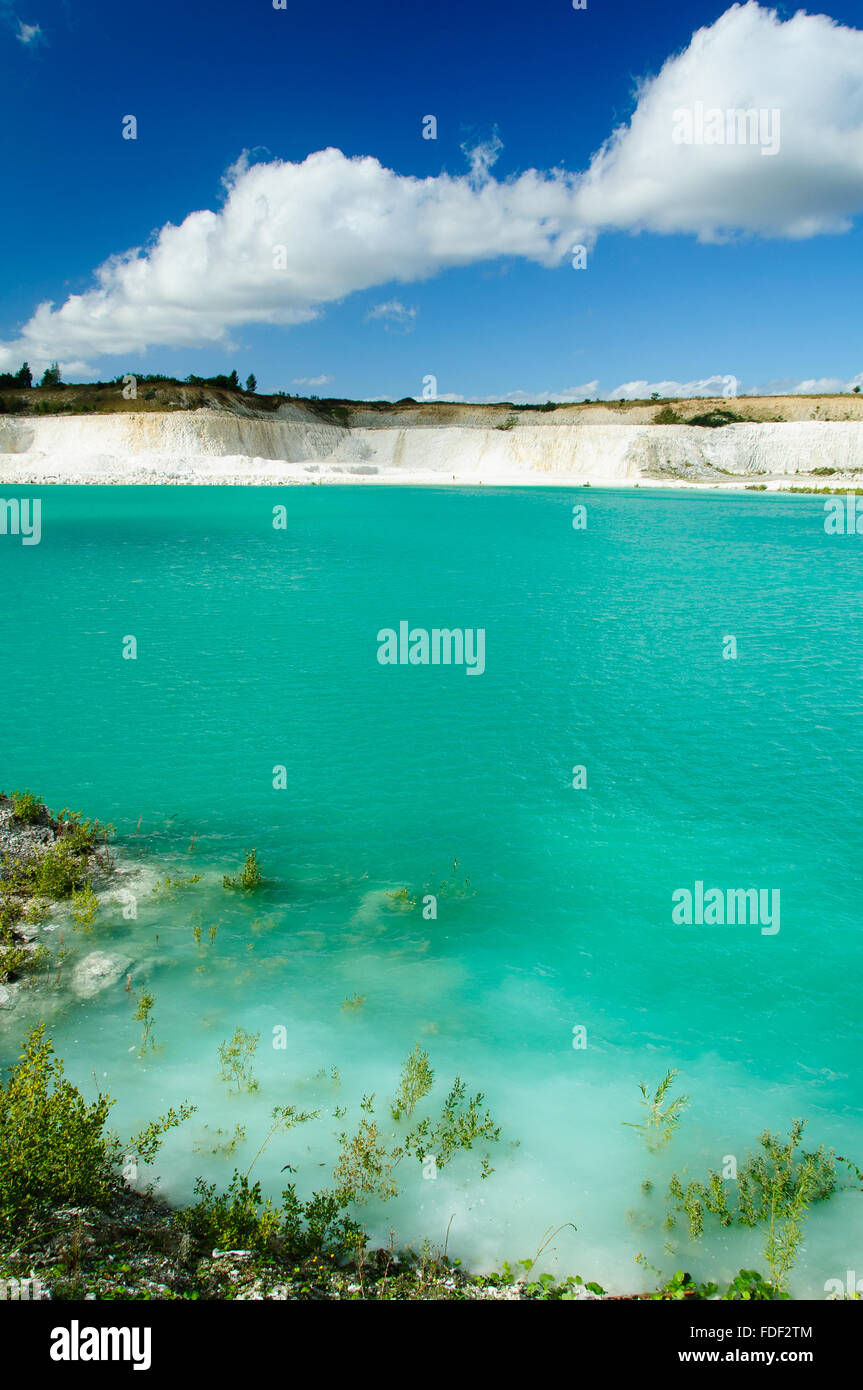 A turquoise lake with white cliff Stock Photo