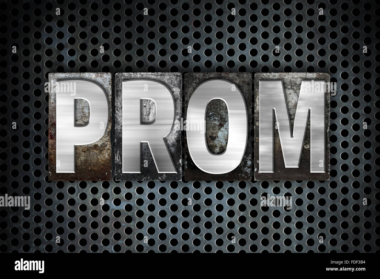 The word 'Prom' written in vintage metal letterpress type on a black industrial grid background. Stock Photo