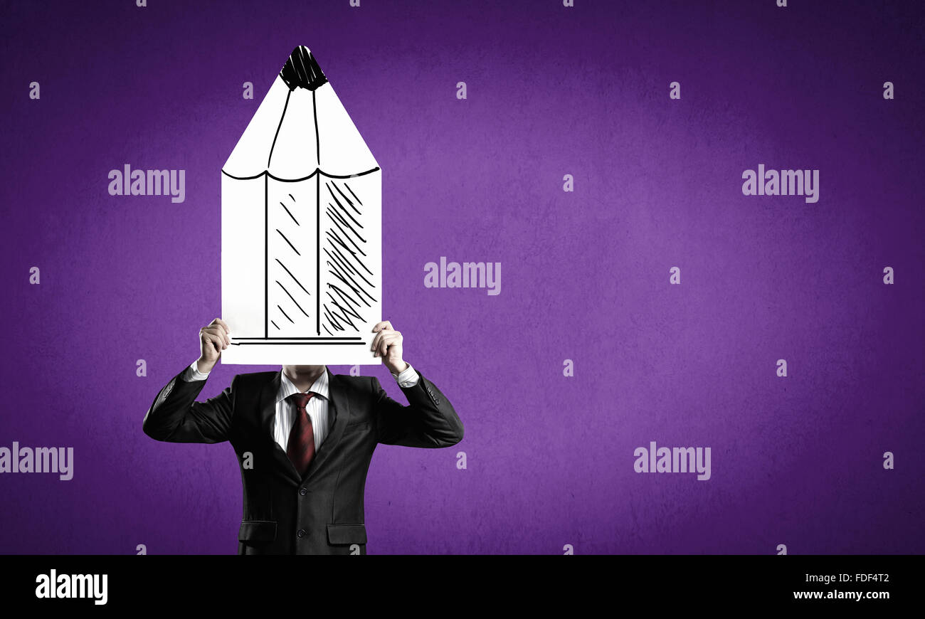 Businessman hiding his face behind paper sheet Stock Photo