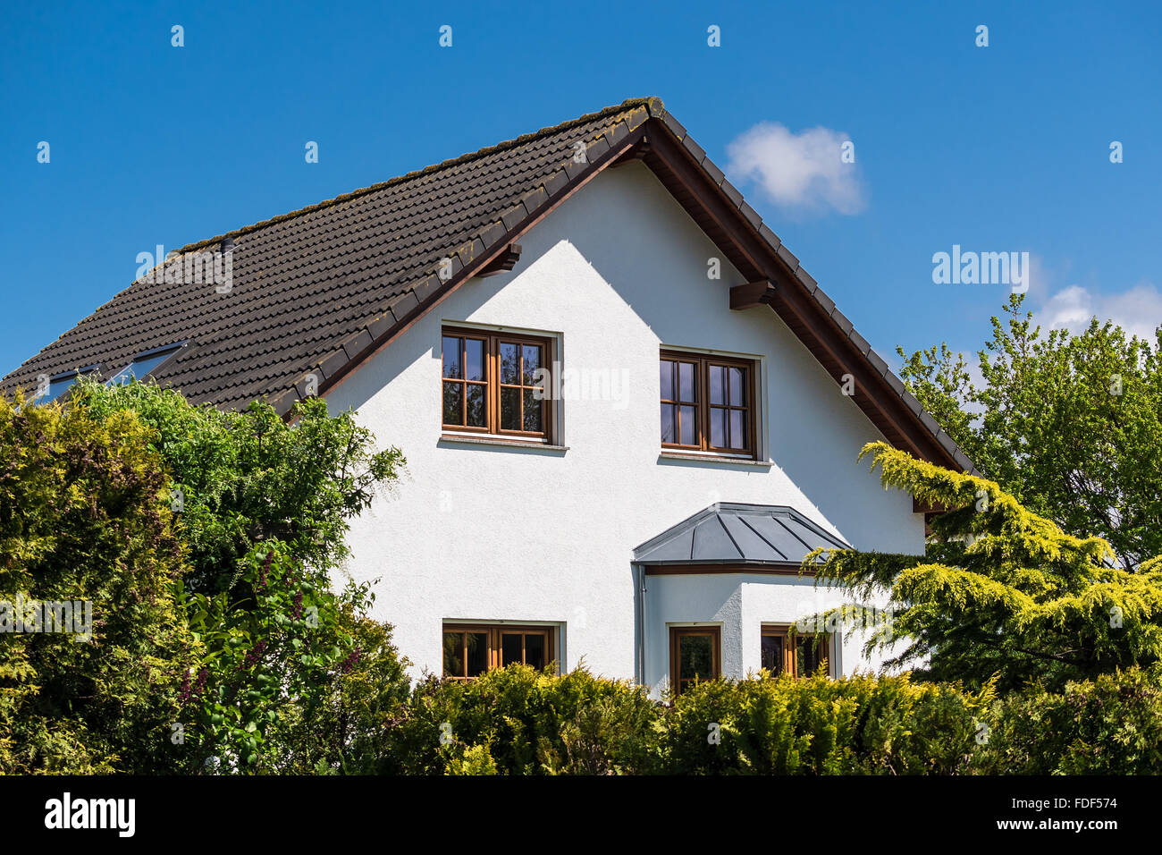 A detached house with blue sky Stock Photo - Alamy