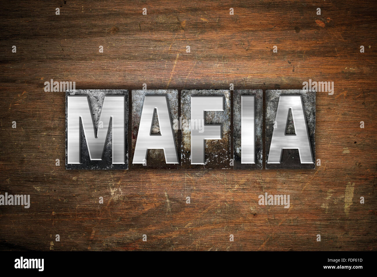 The word "Mafia" written in vintage metal letterpress type on an aged
