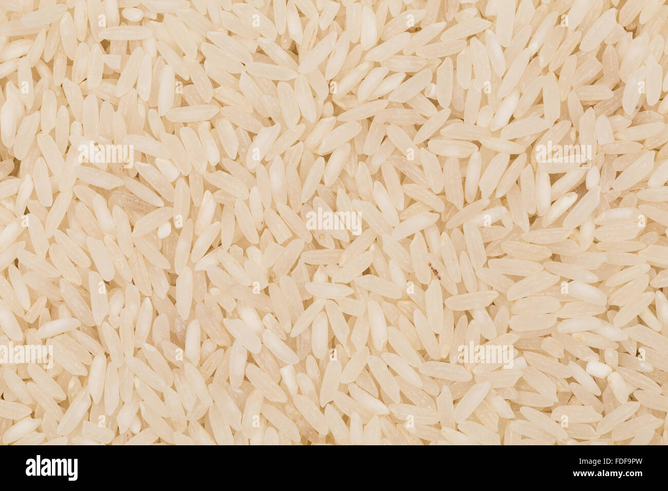 Asian white rice or uncooked white rice Stock Photo - Alamy