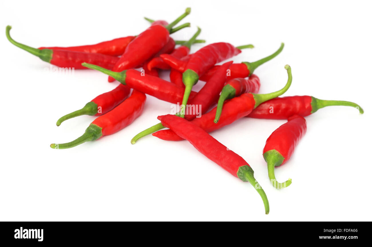 Red chili peppers over white background Stock Photo - Alamy