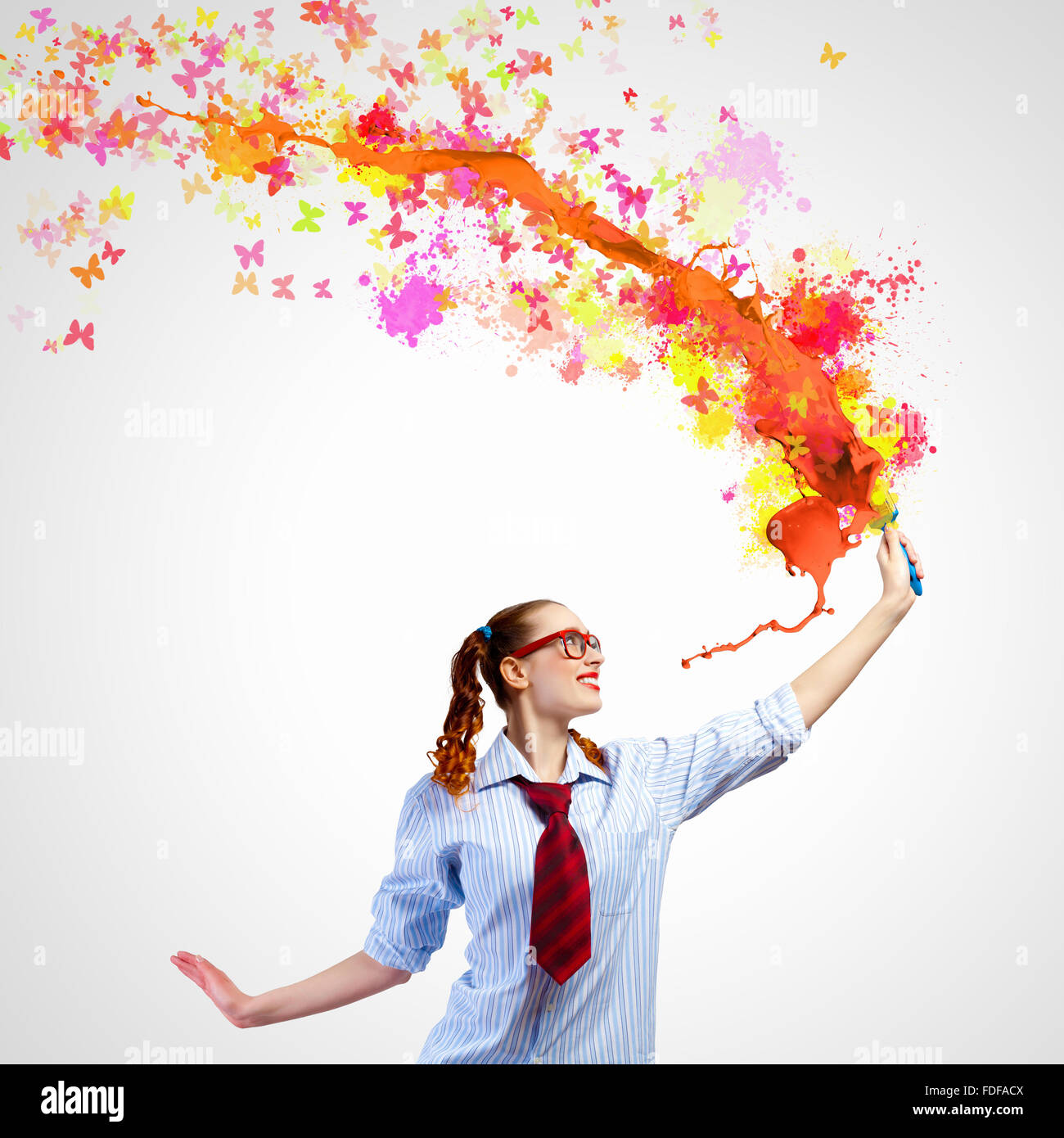Image of young woman painter with brush Stock Photo