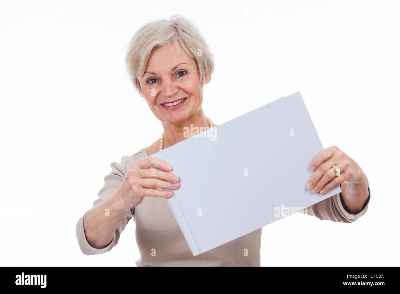 beautiful happy smiling older senior women holding sign with text space for advertising Stock Photo