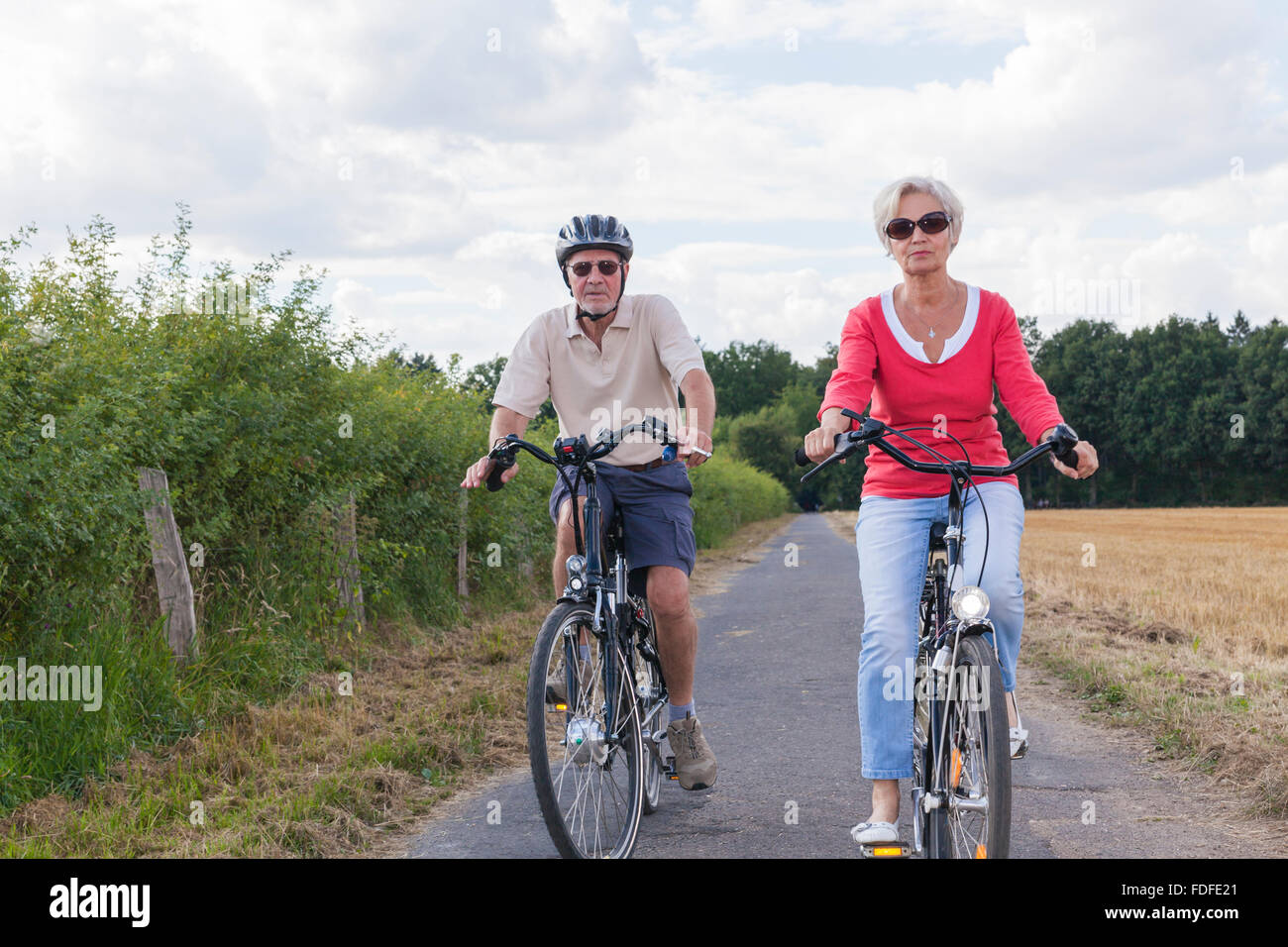 attractive active senior people on bike trip in spring summer fall autumn Stock Photo