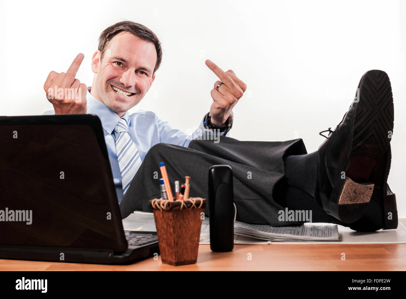 office employee working, answering phone, tired, happy, stressed, work life balance Stock Photo