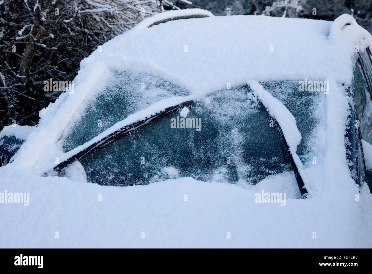 Windscreen wipers clearing snow from car windscreen, Bentley, Ipswich