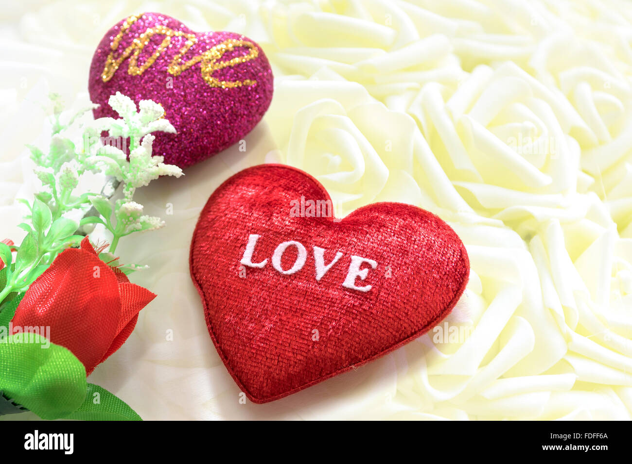 Red heart shaped and red roses on white background sign for love and ...