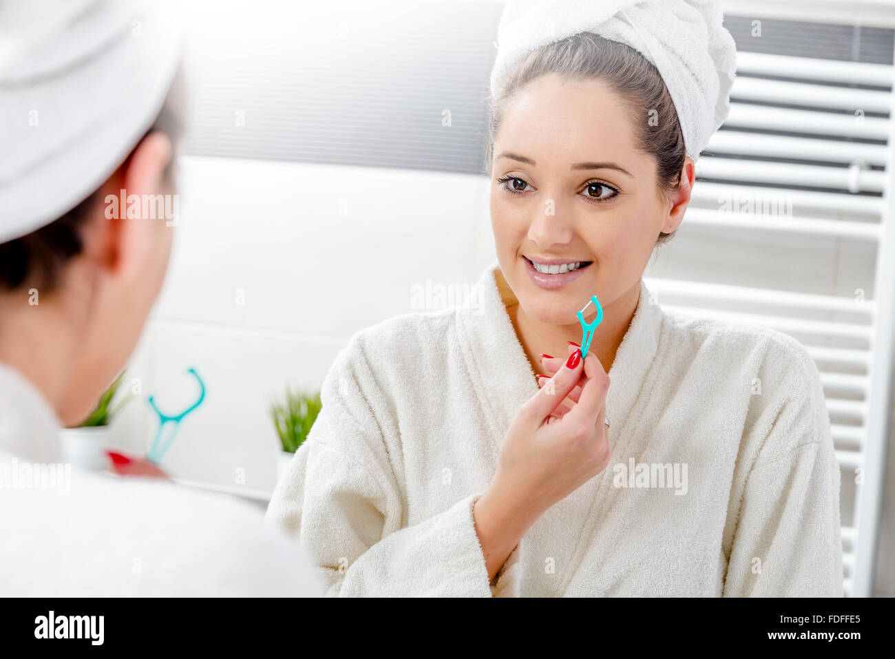 Woman in bathroom Stock Photo - Alamy