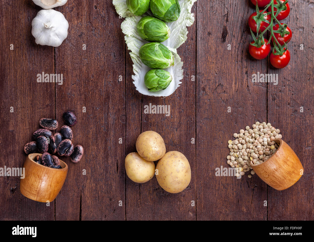 Fresh and healthy organic vegetables and food ingredients on wooden background Stock Photo