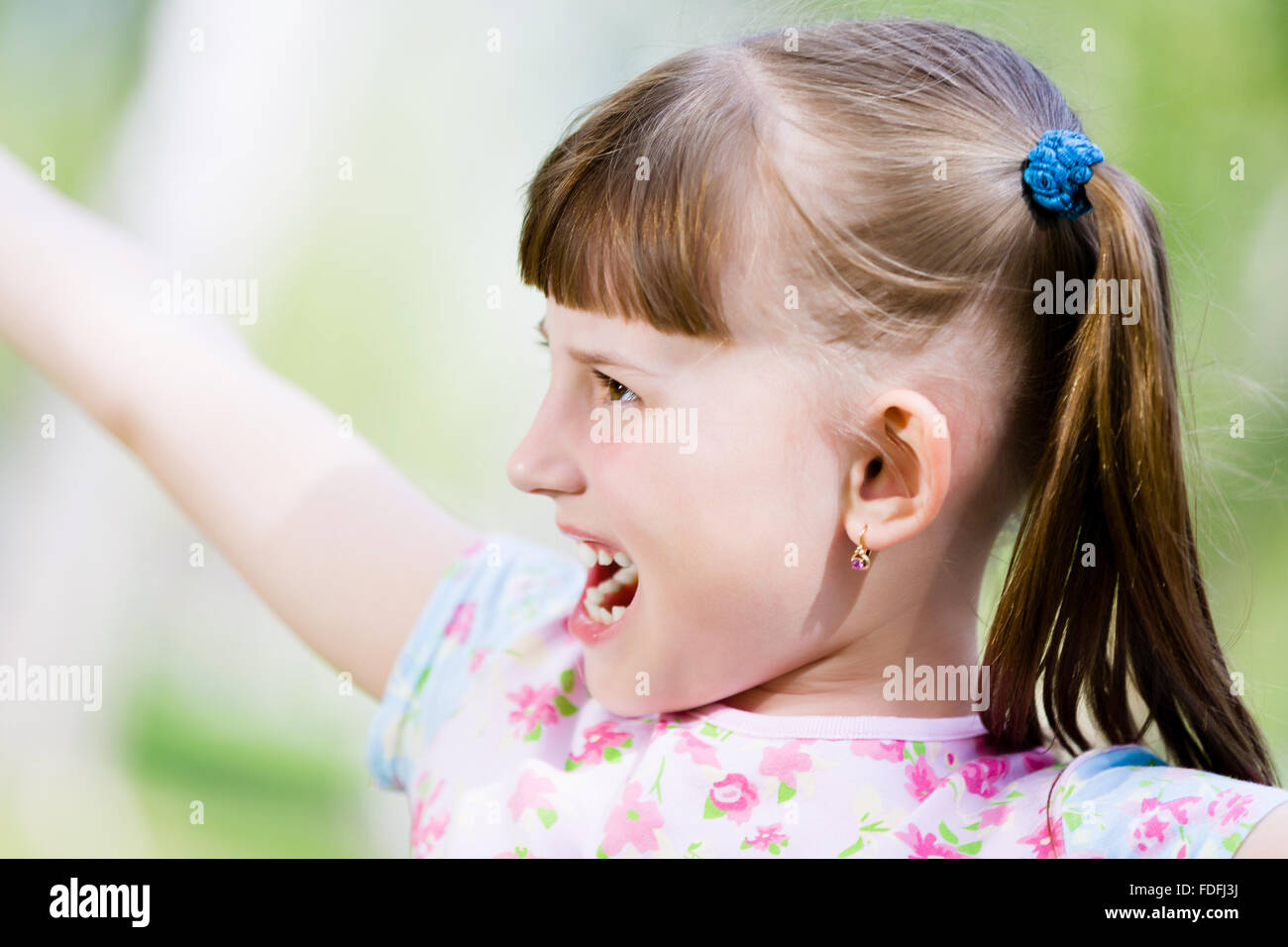 Image of little cute girl playing on grass in park Stock Photo - Alamy
