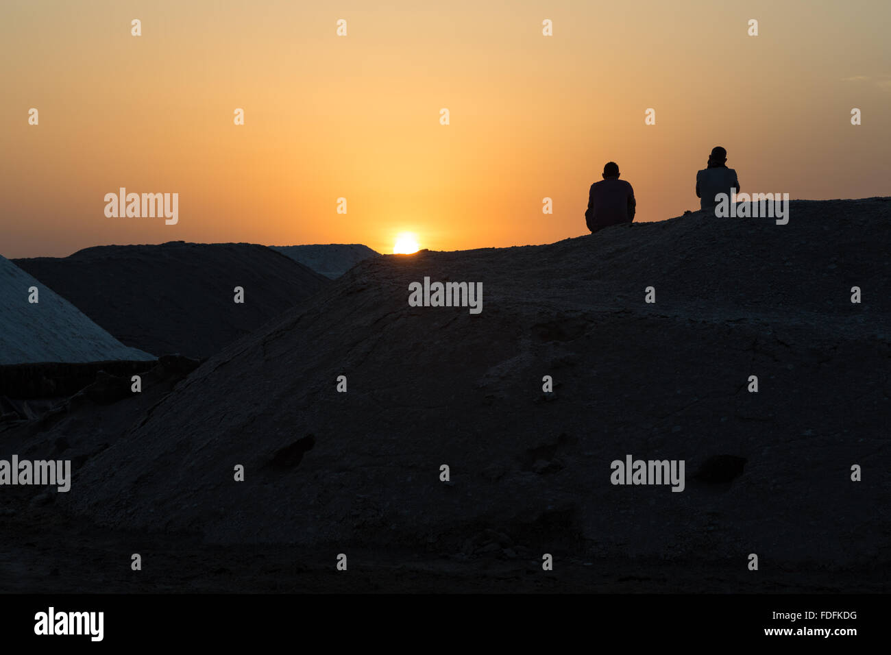 Sunset over the evaporation pools at the salt mines of Afrera Stock Photo