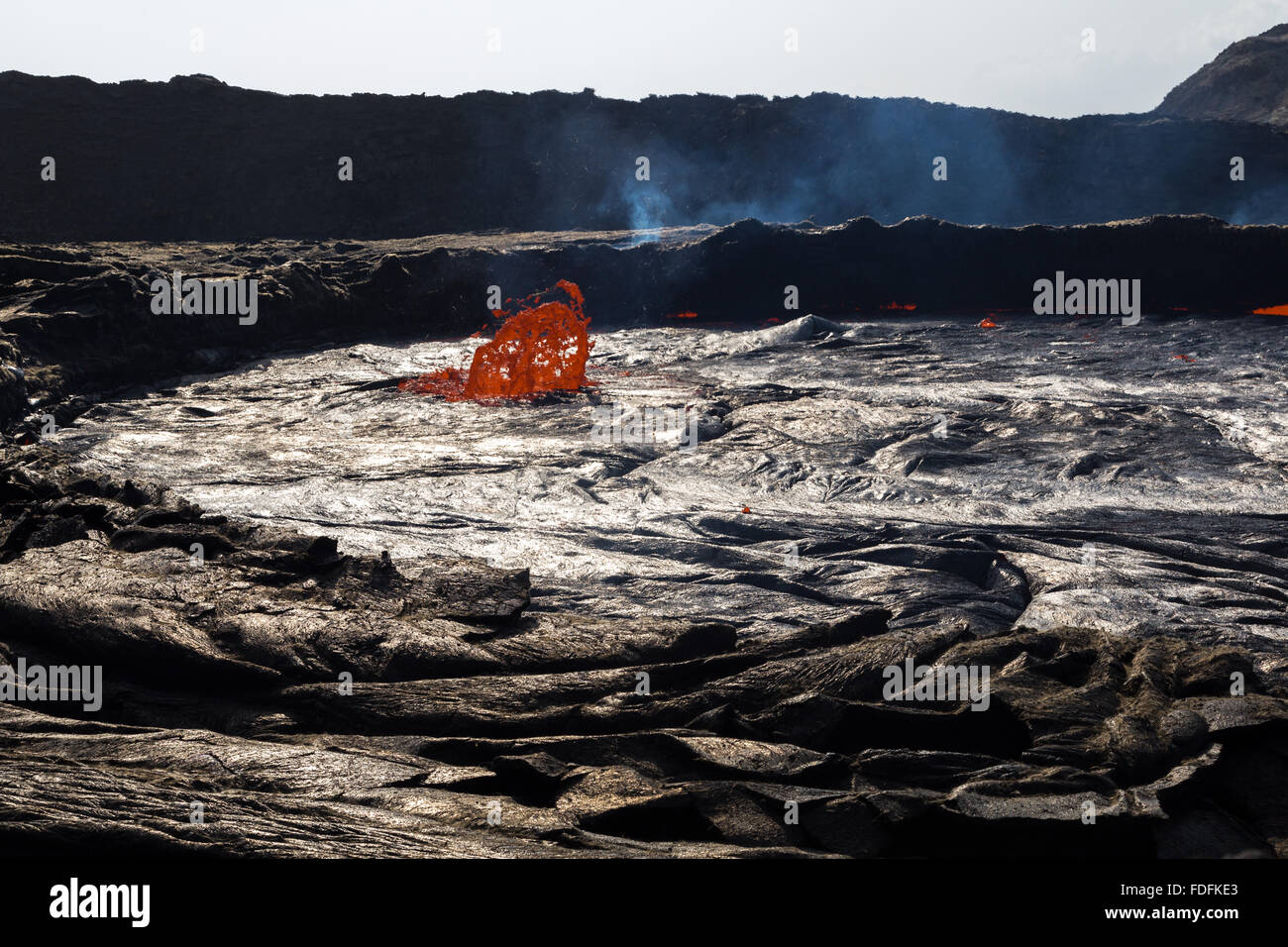 Early morning activity at the unusually high lava lake at Erta Ale Stock Photo