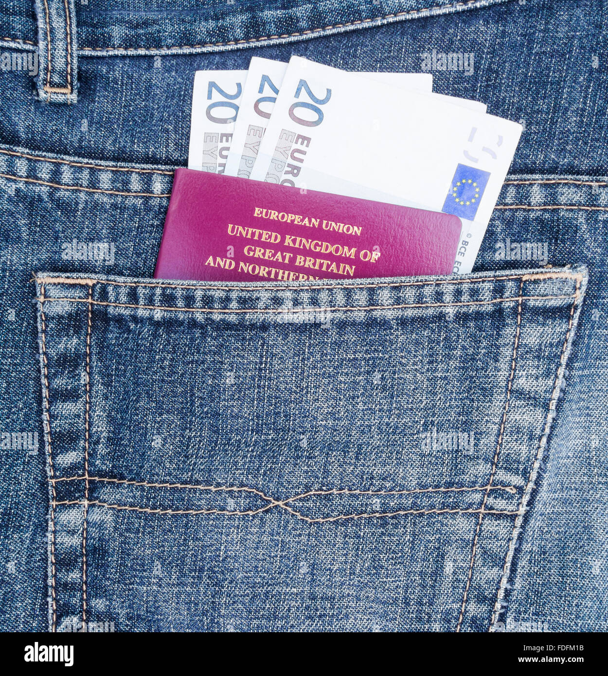 Passport and Euro notes in back pocket of jeans. Travel concept Stock Photo