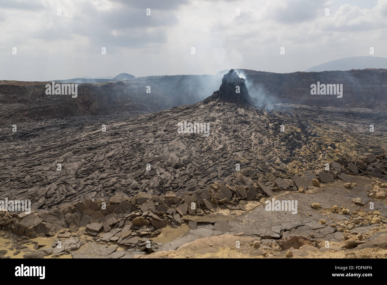 A steaming Hornito lies at the center of a sunken crater inside the main caldera of Erta Ale volcano, Ethiopia Stock Photo