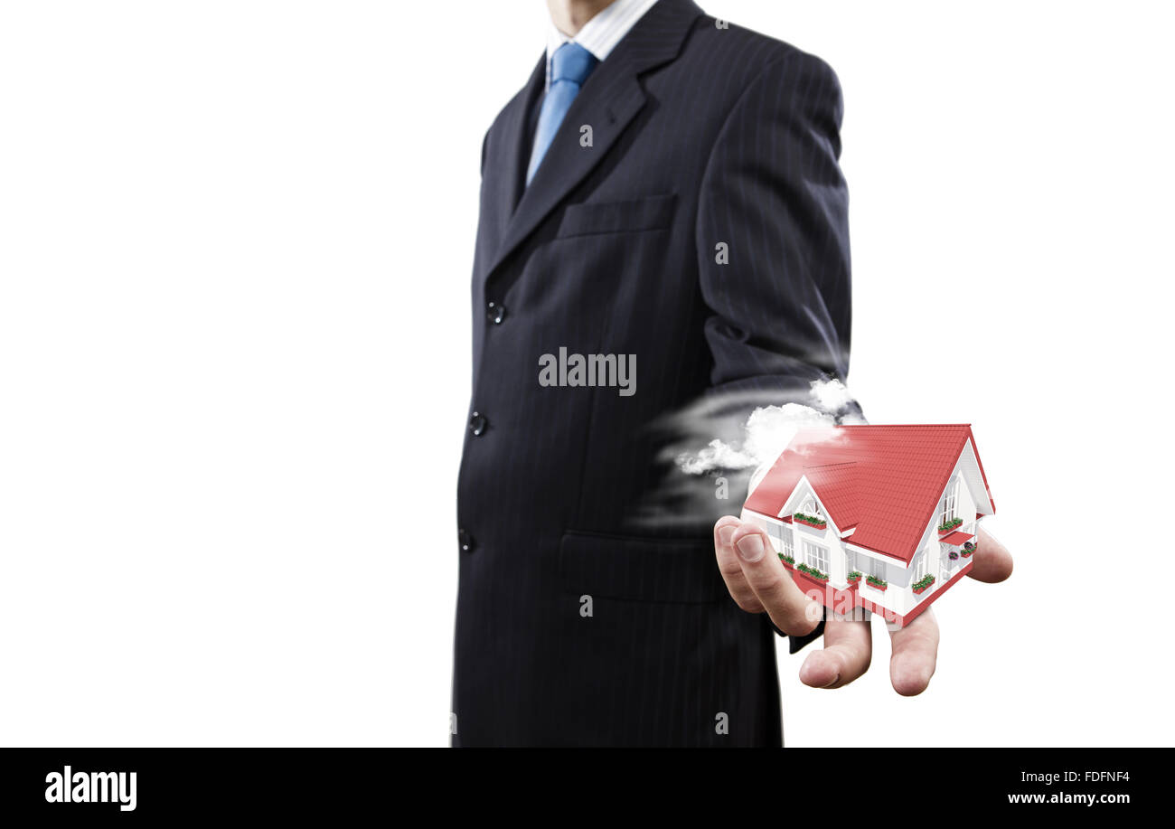 Close up of businessman holding house model in palm Stock Photo - Alamy