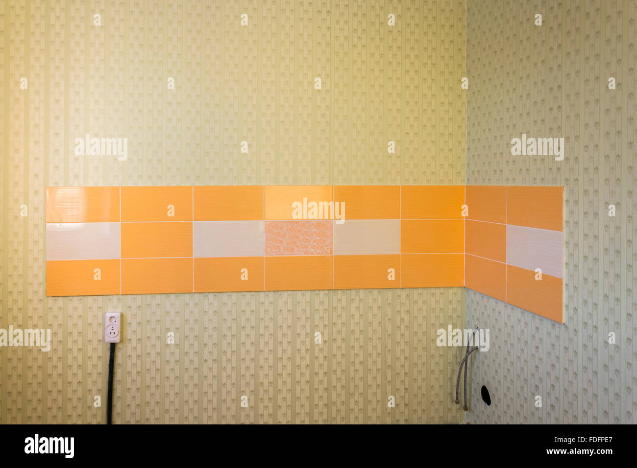 Ceramic tiles on a wall after repair Stock Photo Alamy