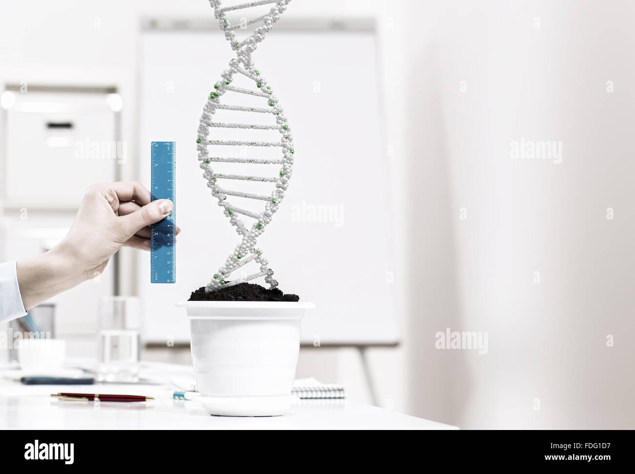 Close up of male hand measuring DNA molecule with ruler Stock Photo - Alamy
