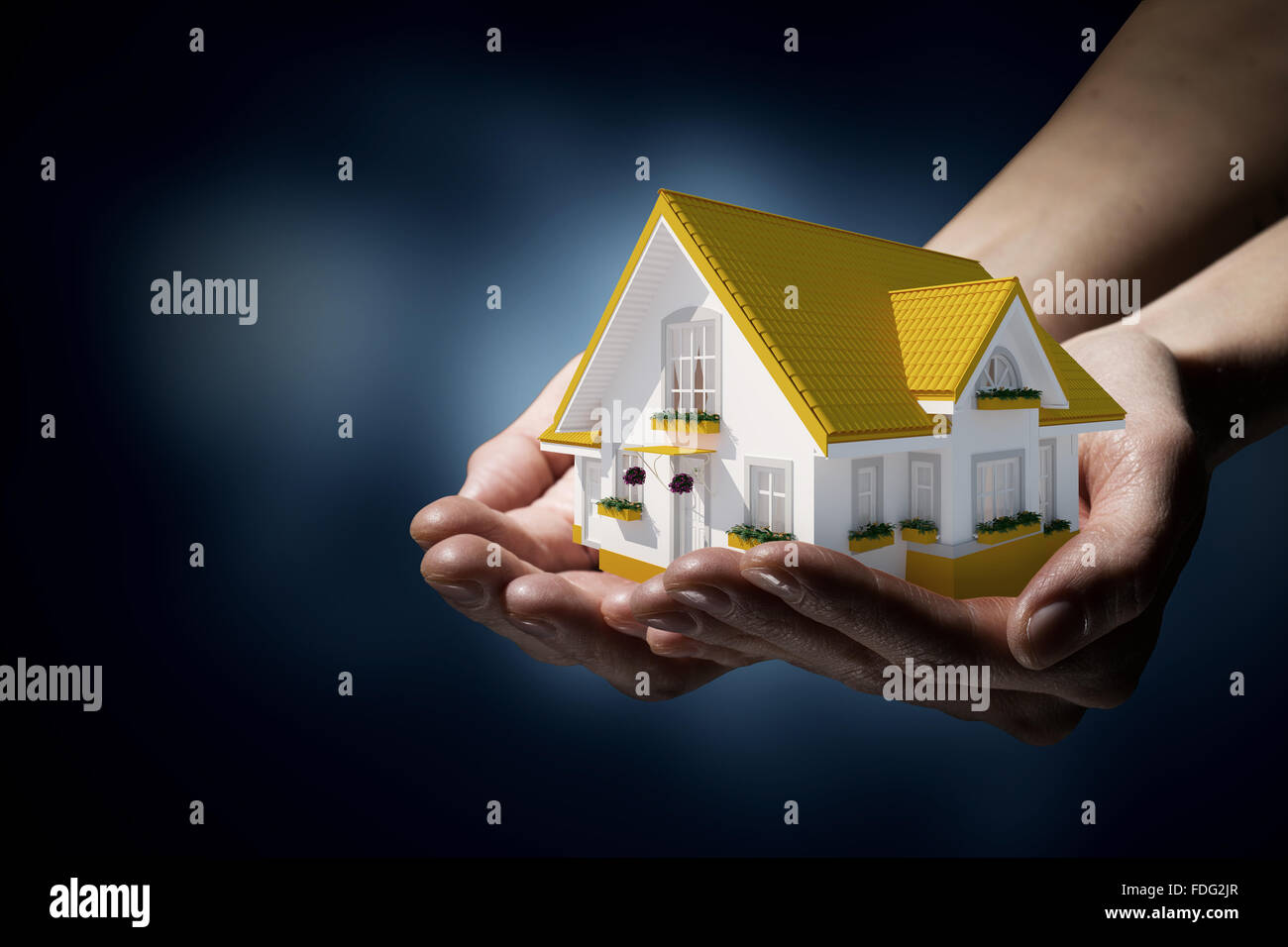Human hands holding model of dream house Stock Photo - Alamy