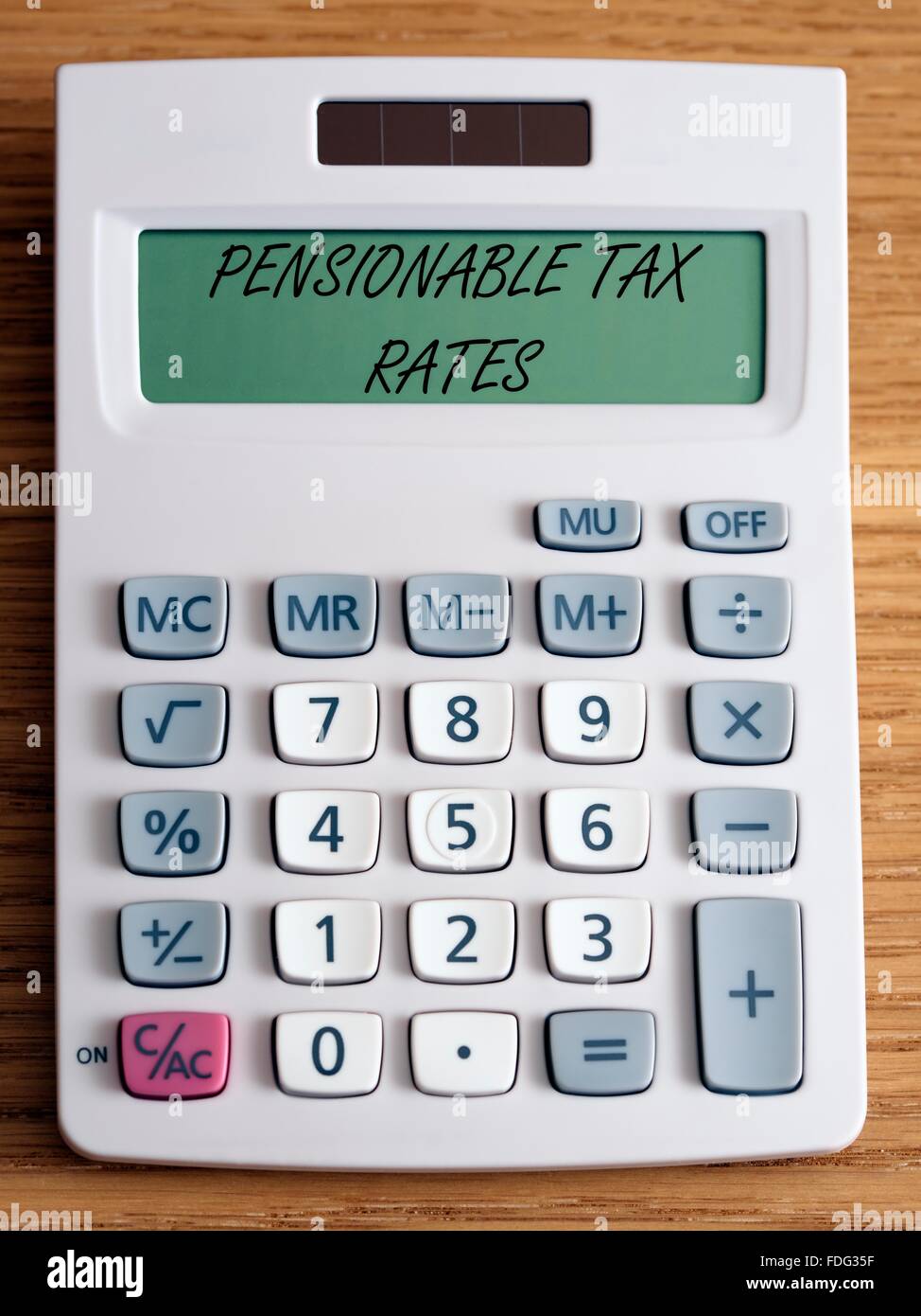 Pensionable tax rates on a calculator screen. Stock Photo