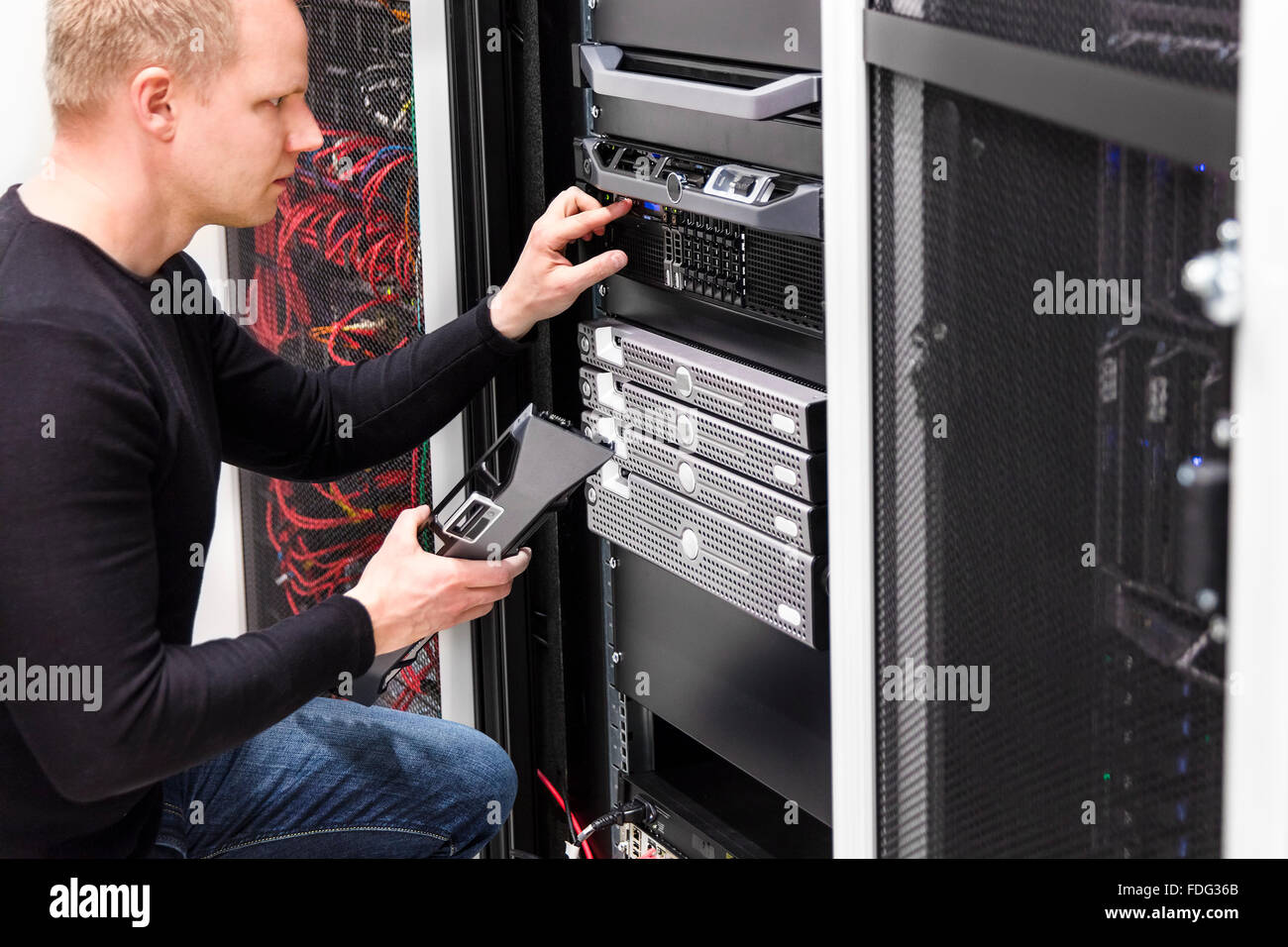 It technician maintain servers an SAN in datacenter Stock Photo