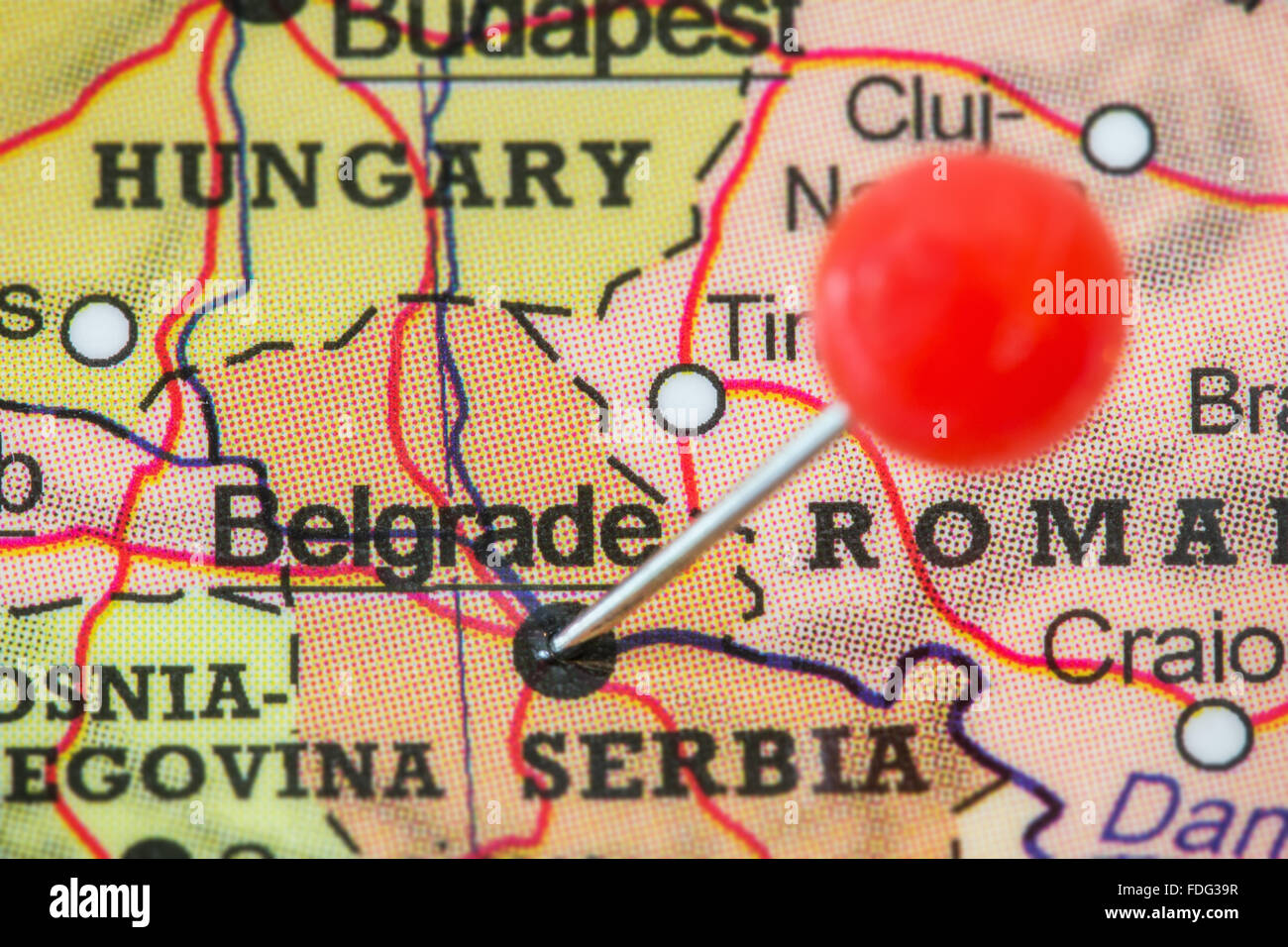 Close-up of a red pushpin in a map of Belgrade, Serbia. Stock Photo
