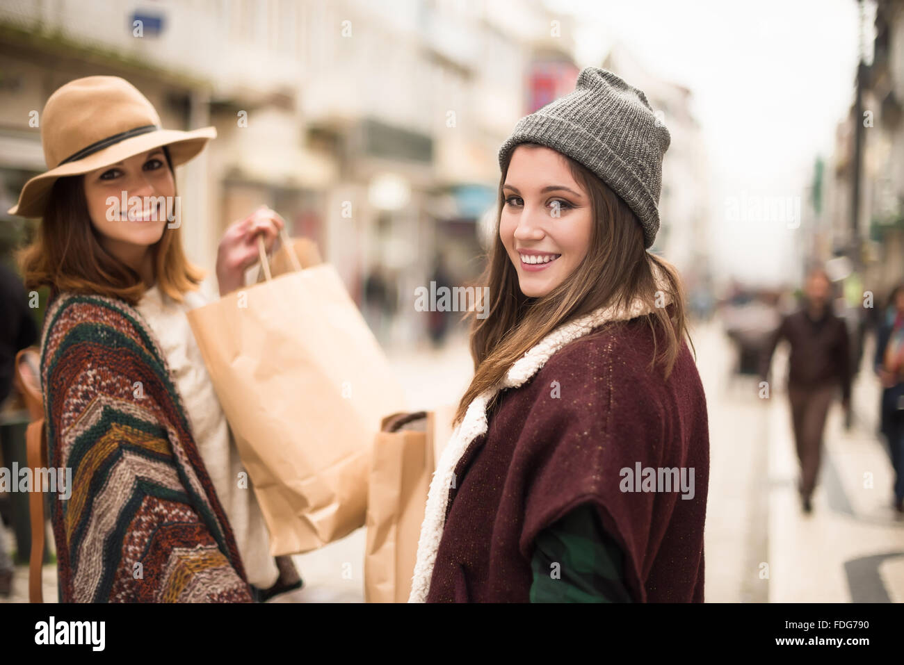 Trendy young women shopping in the city Stock Photo - Alamy