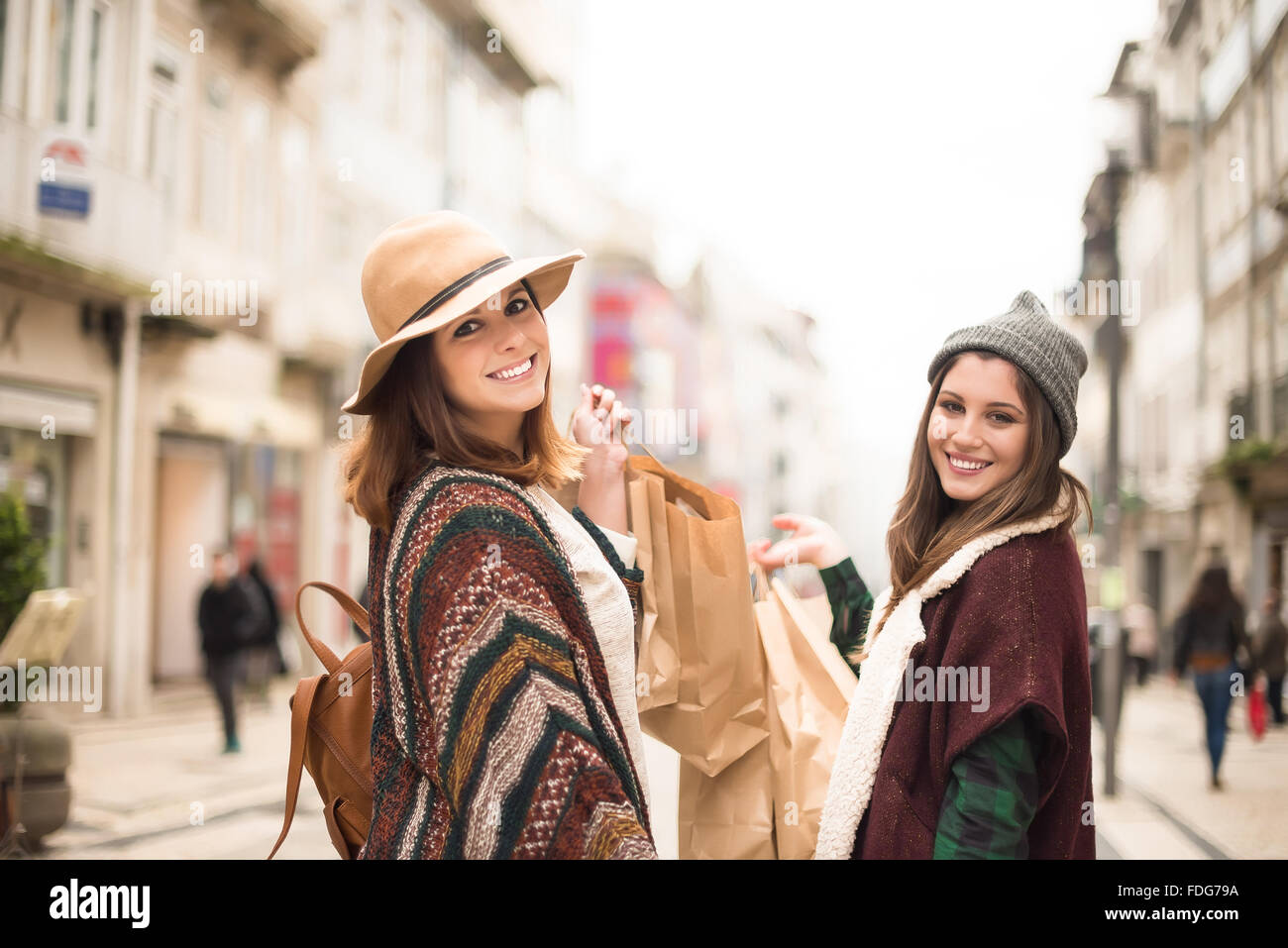 Trendy young women shopping in the city Stock Photo - Alamy