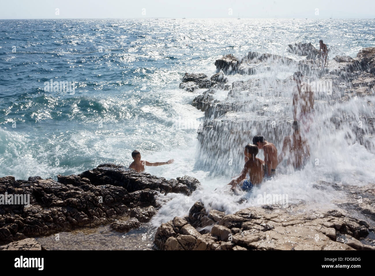 Boys playing in the sea Stock Photo - Alamy