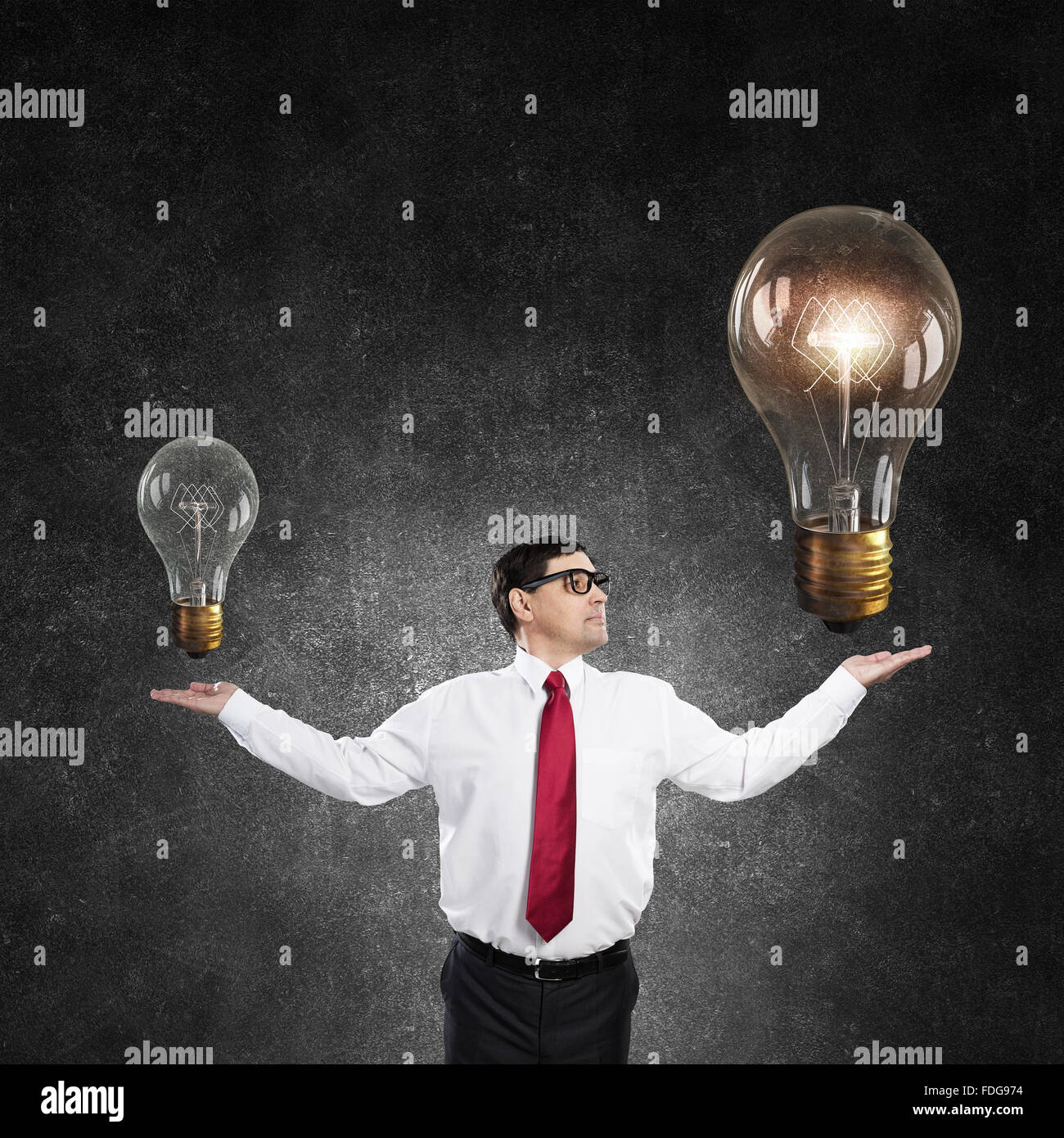 Confident middleaged businessman with hands spread apart Stock Photo