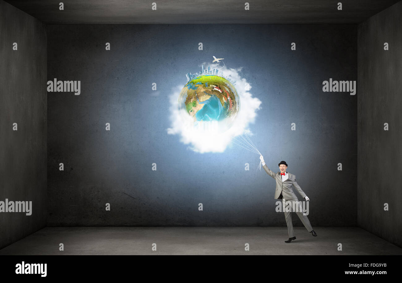 Businessman catch Earth planet with rope . Elements of this image are ...