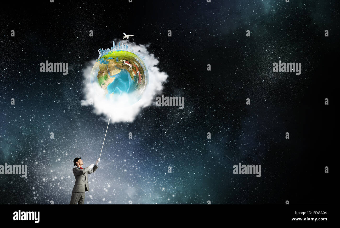 Businessman catch Earth planet with rope . Elements of this image are ...