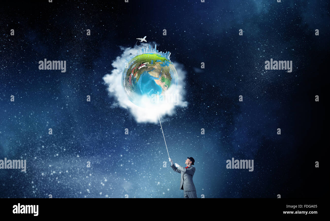 Businessman catch Earth planet with rope . Elements of this image are ...