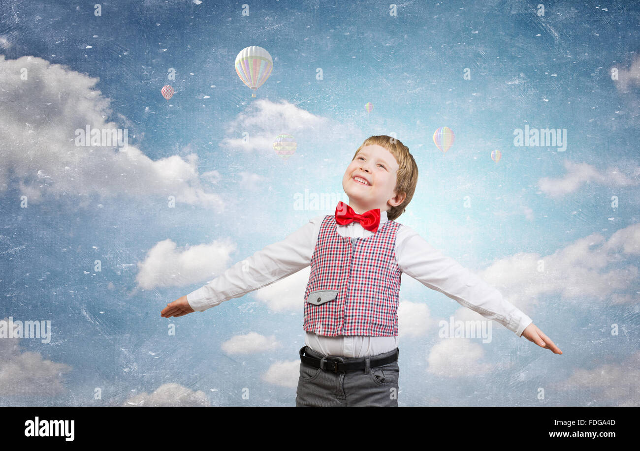 Happy kid boy with hands spread imagine he is flying Stock Photo - Alamy