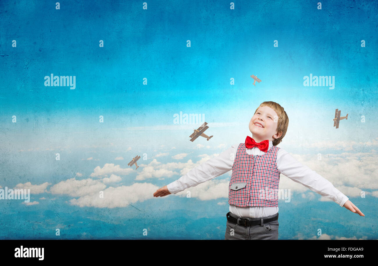 Happy kid boy with hands spread imagine he is flying Stock Photo - Alamy