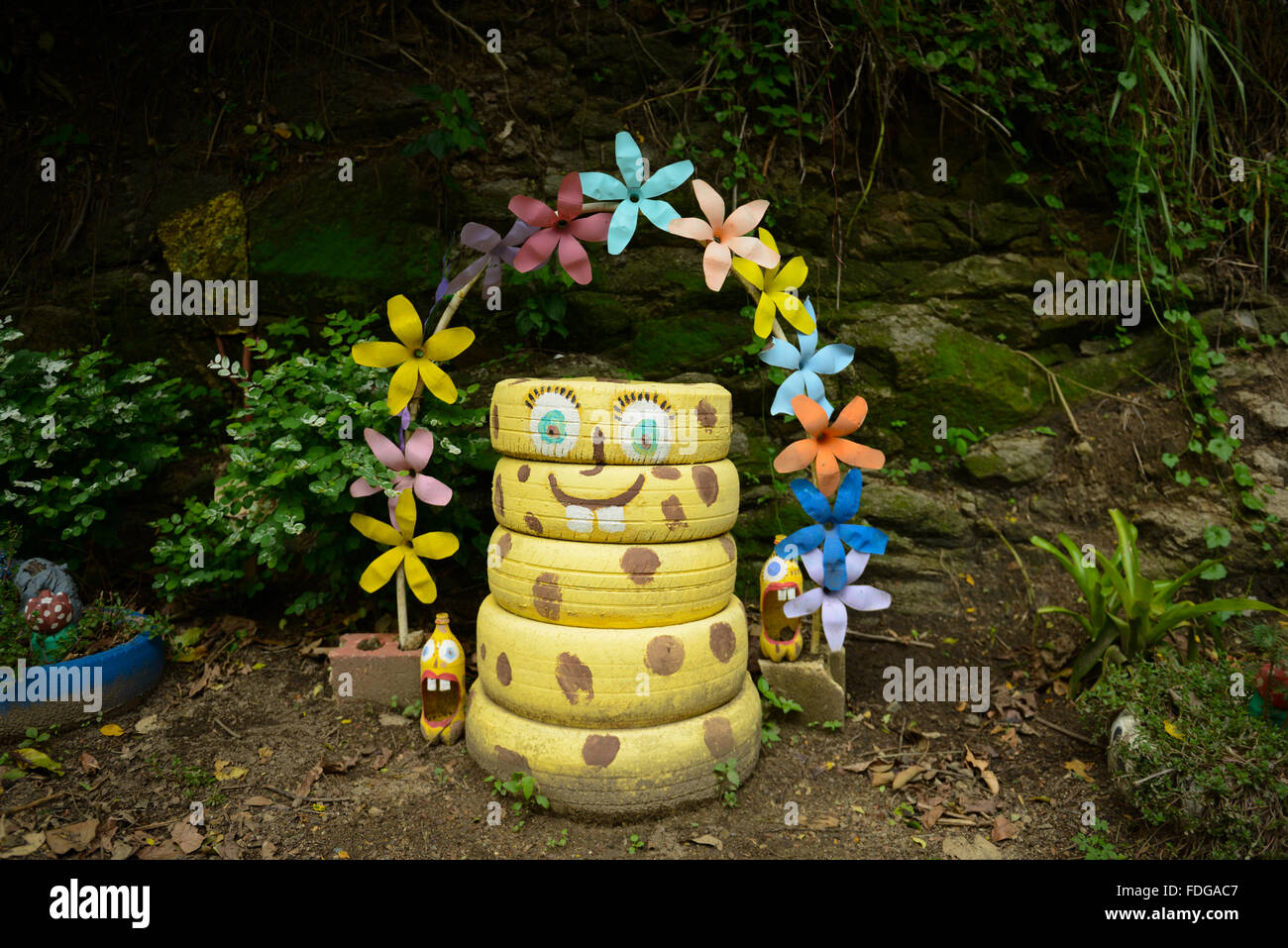 Garden decorations made out of recycled objects. PUERTO RICO - Utuado. Caribbean Island. US territory. Stock Photo