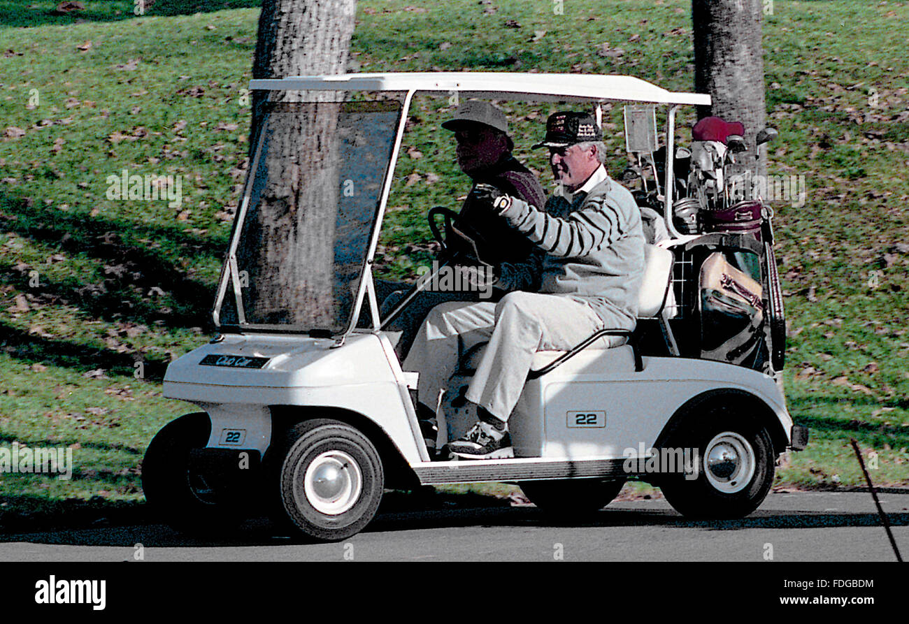 Little Rock, Arkansas, USA, 7th November, 1992 President Elect William Clinton drives himself and Webster Hubbell  in a golf cart around the Chenal Valley Country Club  golf course in Little Rock days after winning the election.  Credit: Mark Reinstein Stock Photo
