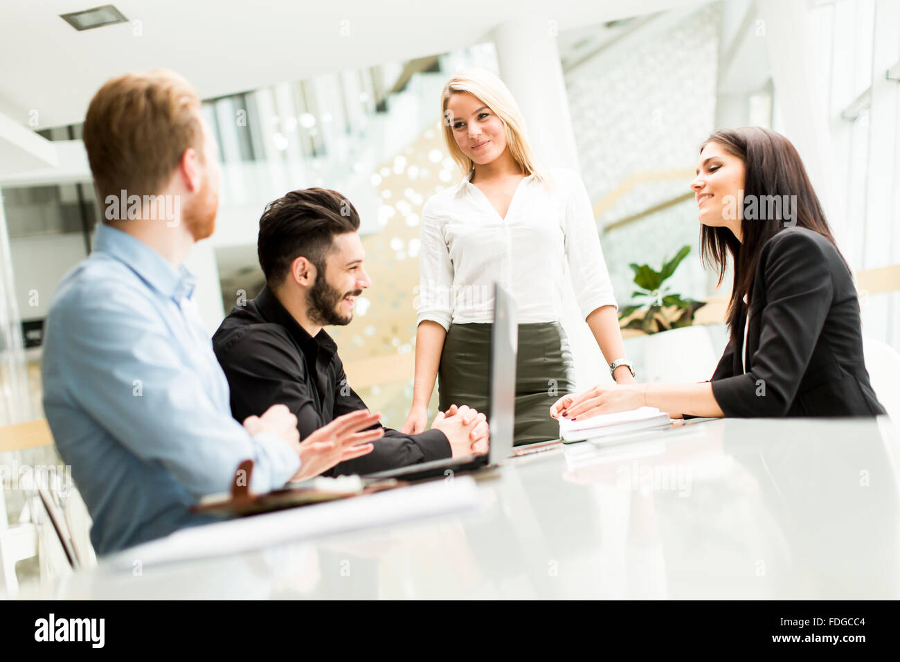 Young people working in the office Stock Photo - Alamy