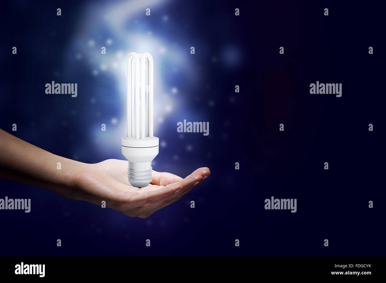Close up of hand holding glowing light bulb Stock Photo - Alamy
