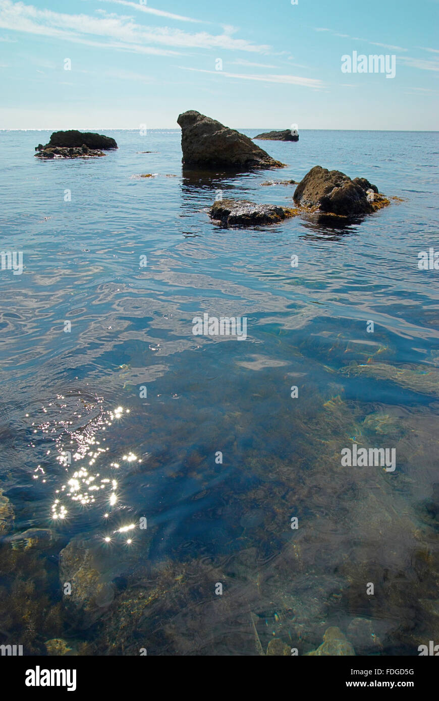 Sea landscape with rocks and water surface Stock Photo - Alamy
