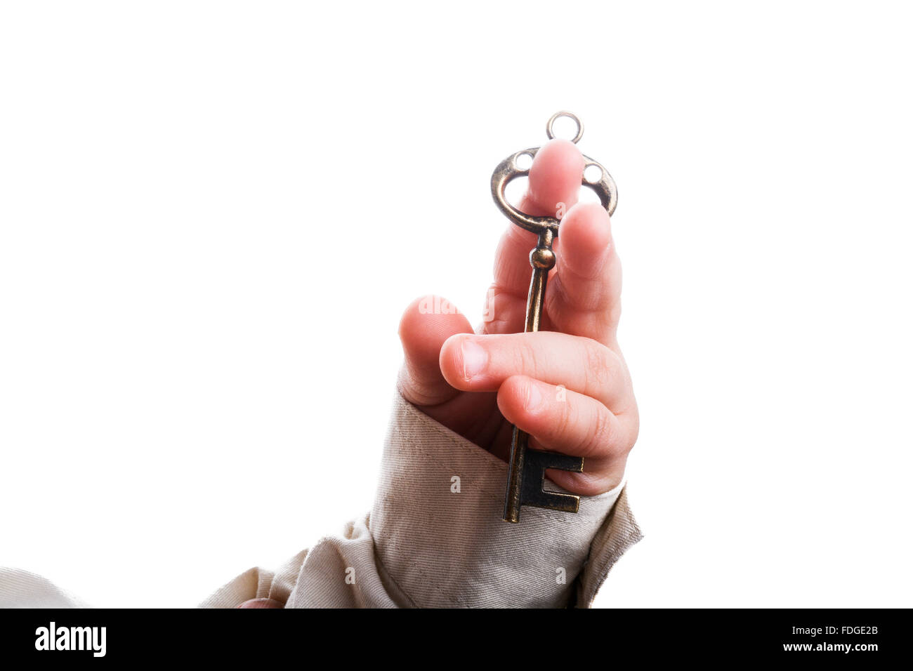 baby's hand holding a retro styled metal key on a white background ...