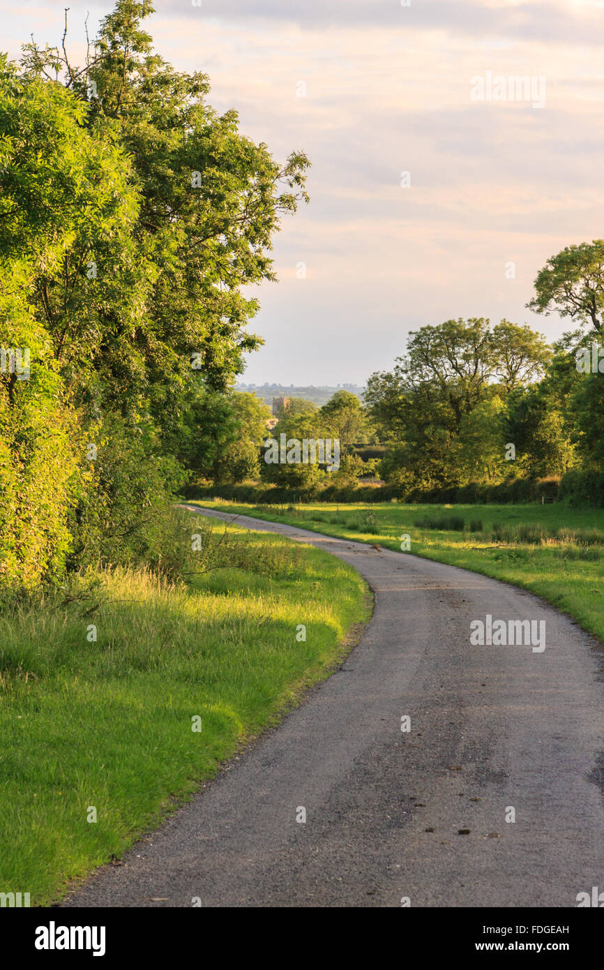 Country lane to sleepy village UK Stock Photo