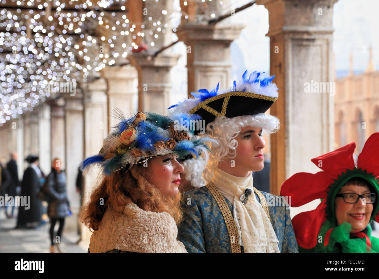 Classic versus modern. Happy tourists at Carnevale di Venezia -  Venice Carnival 2016 Stock Photo